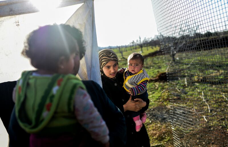 About 30,000 Syrians were at the Turkish border after fleeing a Russia-backed regime offensive on the northern region of Aleppo, Turkish Prime Minister Ahmet Davutoglu said on February 8, 2016, as his country faced pressure to open its border. AFP