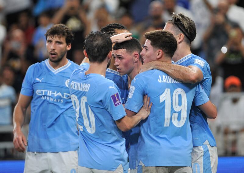 Manchester City's Phil Foden celebrates with teammates after Fluminense's Nino scores an own goal. Reuters