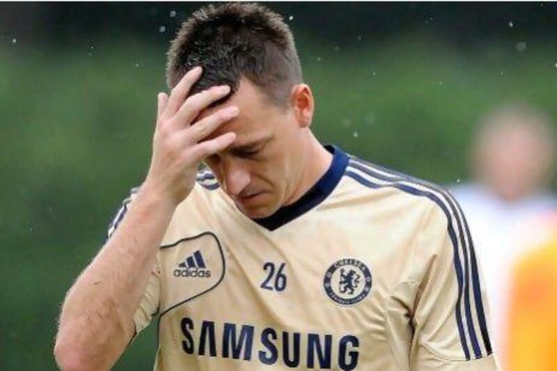 John Terry has escaped criminal charges but now faces the English Football Association for alleged use of racist languar. Patrick McDermott / Getty Images / AFP