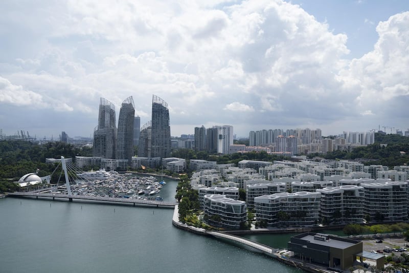 Commercial and residential buildings stand in Singapore on Monday, July 6, 2020. Prime Minister Lee Hsien Loong vowed to hand over Singapore “intact” and in “good working order” to the next generation of leaders, predicting the coronavirus crisis will “weigh heavily” on the nation’s economy for at least a year. Photographer: Wei Leng Tay/Bloomberg