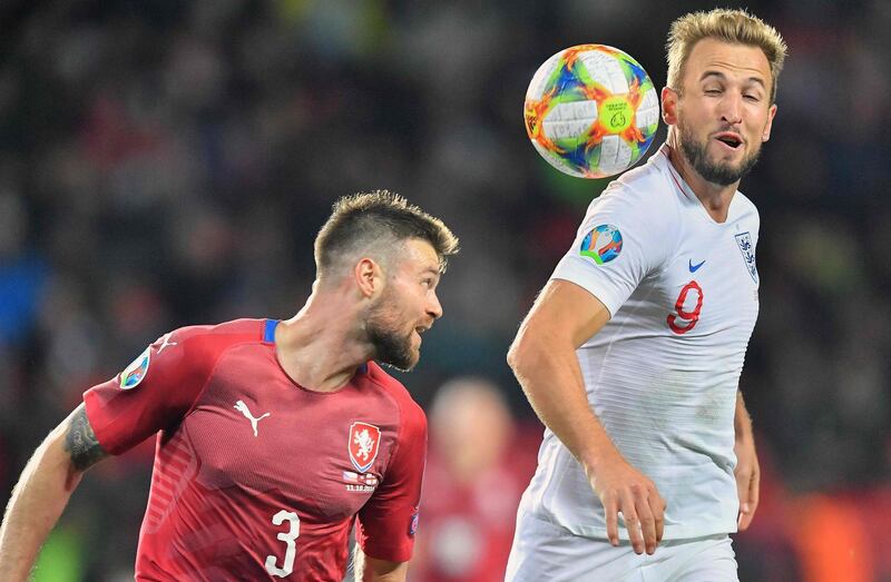 England's captain Harry Kane (R) and Czech Republic's Ondrej Celustka vie for the ball during the UEFA Euro 2020 qualifier Group A football match Czech Republic v England at the Sinobo Arena.  AFP