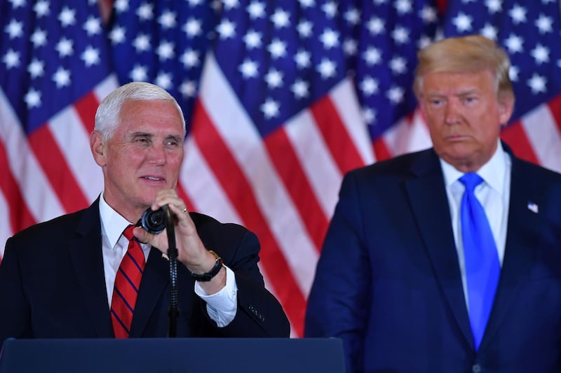 US Vice President Mike Pence speaks flanked by US President Donald Trump during election night in the East Room of the White House in Washington, DC.  AFP