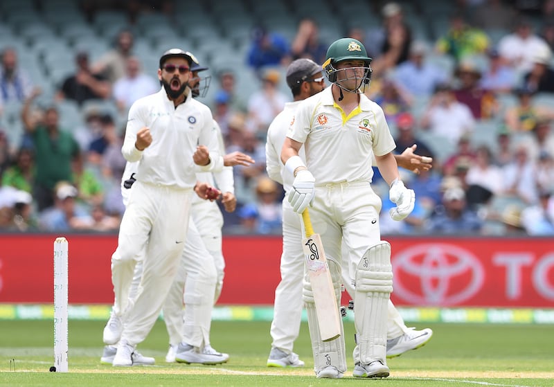epa07213872 Australian batsman Marcus Harris (R) leaves the field after being dismissed by Indian bowler Ravichandran Ashwin during day two of the first Test match between Australia and India at the Adelaide Oval in Adelaide, Australia, 06 December 2018.  EPA/DAVE HUNT AUSTRALIA AND NEW ZEALAND OUT, EDITORIAL USE ONLY, NO USE IN BOOKS, NEWS REPORTING PURPOSES ONLY