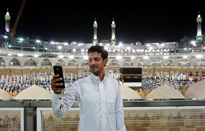 A Muslim pilgrim takes a selfie at the Grand Mosque in the holy Saudi city of Mecca, early on August 30, 2017, on the eve of the start of the annual Hajj pilgrimage.
For the faithful it is a deeply spiritual journey, which for centuries every capable Muslim has been required to make at least once in their lifetimes. In the age of social media and live video streaming, it's now also an experience to be shared in real time. / AFP PHOTO / KARIM SAHIB