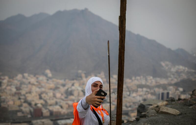 A Muslim worshipper takes selfies as she visits Mount Al-Noor. Mast Irham / EPA