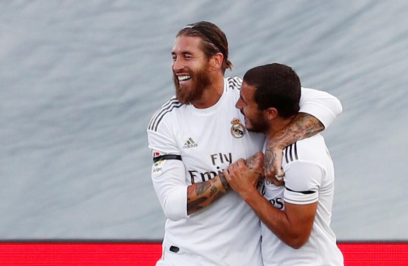 Real Madrid's Sergio Ramos celebrates scoring their second goal with Eden Hazard. Reuters