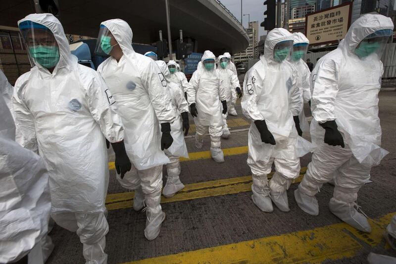 Workers cull chickens during a bird flu outbreak in Hong Kong. Reuters