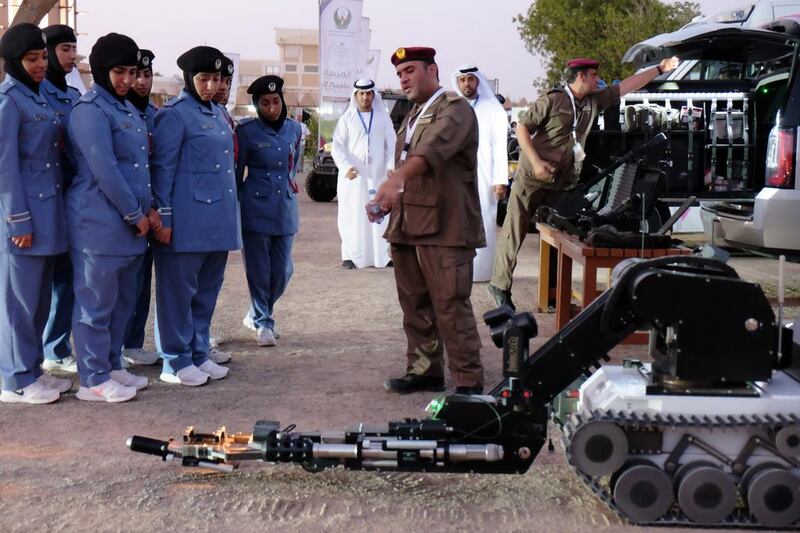 Cadets from the Women’s Police Academy are shown some of the robotic equipment used by police.