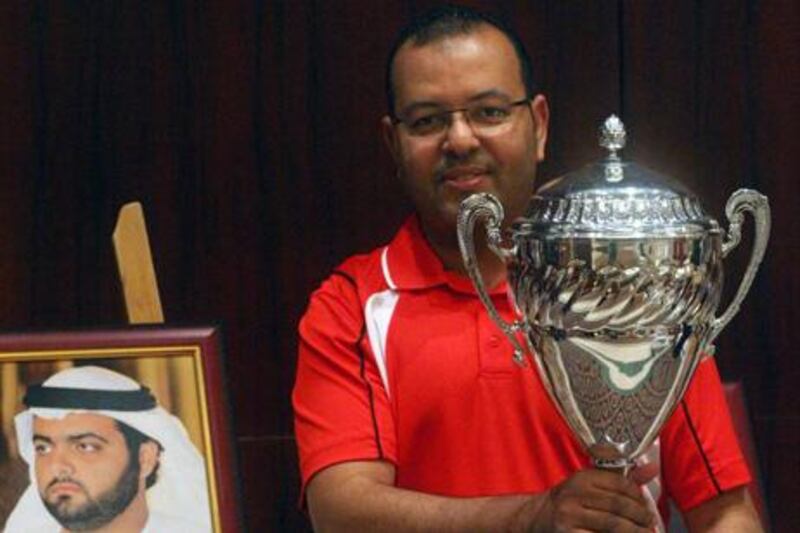 Hani Al Howri with his trophy for winning the 8-ball pool singles at the West Asian Championships.