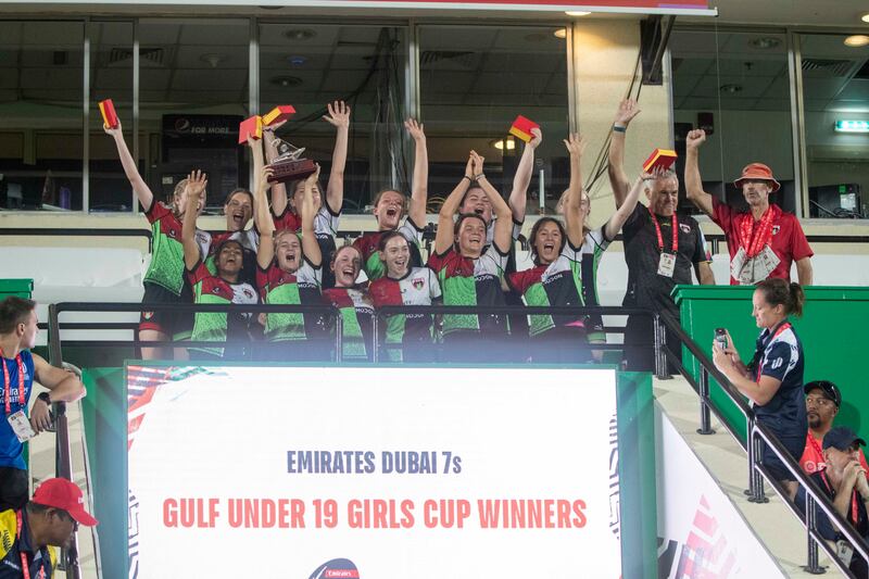 Abu Dhabi Harlequins celebrate with the trophy after beating Dubai Collage in the Gulf Under 19 Girls final at Dubai Sevens.  All photos Ruel Pableo for The National