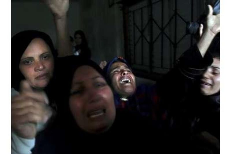 Palestinian relatives of Haya Hamdan, four, and her sister, Lama, 12, who were killed in an Israeli attack, mourn at their funeral in Gaza Strip.