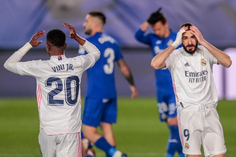 Real Madrid's Vinicius Junior, left, and Karim Benzema after a missed chance. AP