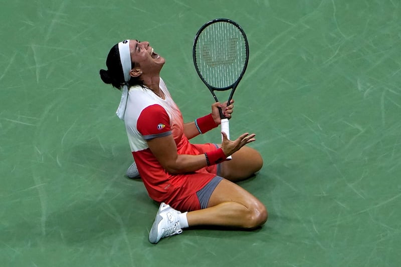 Ons Jabeur celebrates after beating Caroline Garcia. AFP