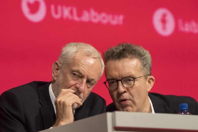 Jeremy Corbyn, leader of the U.K's opposition Labour Party, left, speaks with Tom Watson, deputy leader, during opening speeches at the annual Labour Conference in Liverpool, U.K., on Sunday, Sep. 23, 2018. Corbyn said he wants a general election rather than a second Brexit referendum but will be “bound” by the decision of his membership when it votes Tuesday on the issue. Photographer: Simon Dawson/Bloomberg