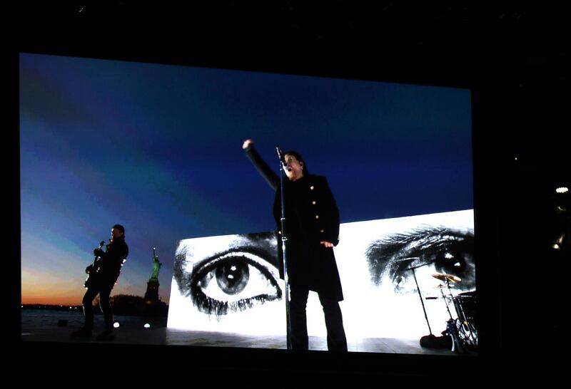 U2 appears on screen as they perform 'Get Out of Your Own Way' via satellite. Matt Sayles / Invision / AP