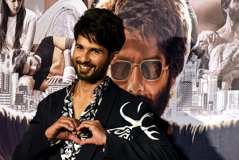 Indian Bollywood actor Shahid Kapoor gestures as he poses for photographs during the trailer launch of the upcoming Hindi film 'Kabir Singh' in Mumbai on May 13, 2019. (Photo by Sujit Jaiswal / AFP)