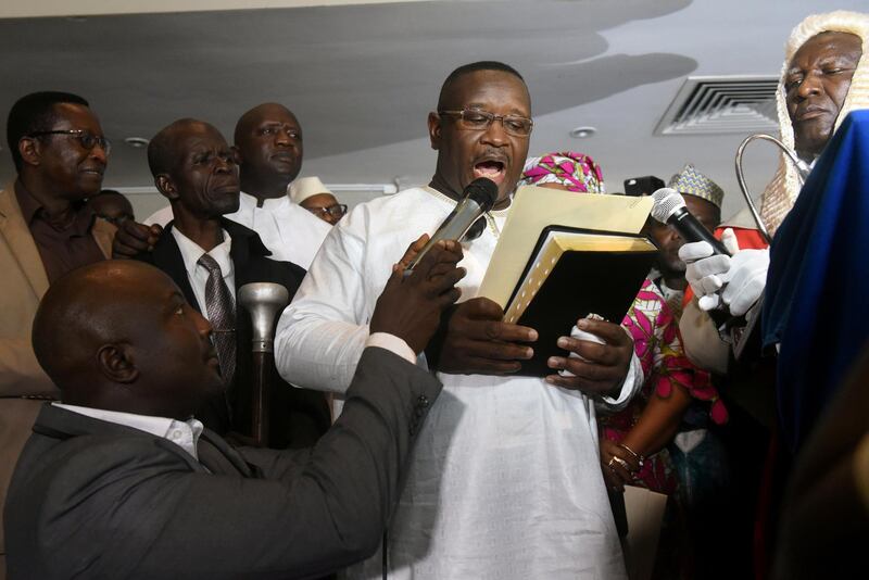Opposition candidate and former military junta leader Julius Maada Bio takes his oath as Sierra Leone's new president in Freetown, Sierra Leone April 4, 2018. REUTERS/Olivia Acland     TPX IMAGES OF THE DAY