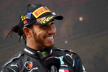 (FILES) In this file photo taken on November 15, 2020 Mercedes' British driver Lewis Hamilton gives an interview after winning the Turkish Formula One Grand Prix at the Intercity Istanbul Park circuit in Istanbul. Lewis Hamilton has ended his long-running contract saga with Mercedes by signing a new one-year deal, the Formula One team announced on February 8, 2021. / AFP / POOL / Clive Mason