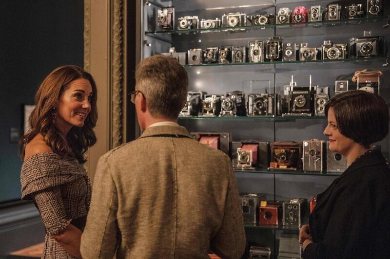 Britain's Catherine, Duchess of Cambridge, views the "Collecting Photography: From Daguerreotype to Digital" exhibition as she officially opens the new photography centre at the Victoria and Albert (V&A) Museum in west London on October 10, 2018. Designed by David Kohn Architects, phase one of the Photography Centre more than doubles the space dedicated to photography at the V&A, spanning four new galleries. The first exhibition in the new wing explores photography as a way of ‘collecting the world’, from the medium’s invention in the 19th century to the present day.  - 
 / AFP / POOL / JACK HILL
