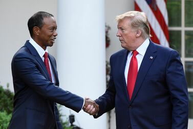 FILE PHOTO: Golfer Tiger Woods is awarded the Presidential Medal of Freedom, the nation's highest civilian honor, by U.S. President Donald Trump in the Rose Garden at the White House in Washington, U.S., May 6, 2019. REUTERS/Clodagh Kilcoyne/File Photo