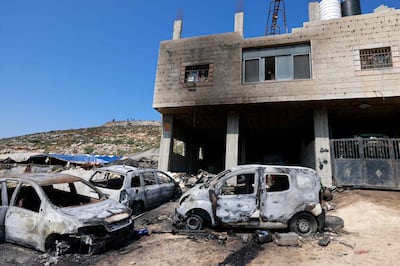 Israeli settlers set fire to several homes and vehicles in Al Mughayyir. AFP