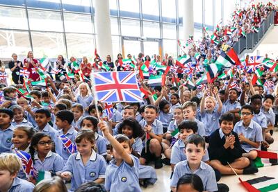 Abu Dhabi, U.A.E., September 24, 2018.  
Launch of 50 year celebrations of British School Al Khubairat.  --  British School students wave the U.A.E. and British flag to great the British Ambassador, Patrick Moody.
Victor Besa / The National
Section:  NA
Reporter:  Haneen Dajani.