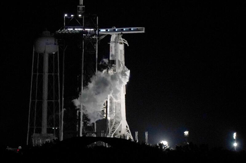 The Crew Dragon spacecraft reached orbit shortly before dawn, Nasa commentators said, with the Falcon 9 booster rocket touching down on one of the company's autonomous drone ships in the Atlantic Ocean. AP Photo