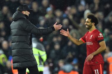 Liverpool manager Jurgen Klopp (L) greets his player Mohamed Salah (R) after winning the English Premier League match between Liverpool and Aston Villa in Liverpool, Britain, 11 December 2021.   EPA/PETER POWELL EDITORIAL USE ONLY.  No use with unauthorized audio, video, data, fixture lists, club/league logos or 'live' services.  Online in-match use limited to 120 images, no video emulation.  No use in betting, games or single club / league / player publications