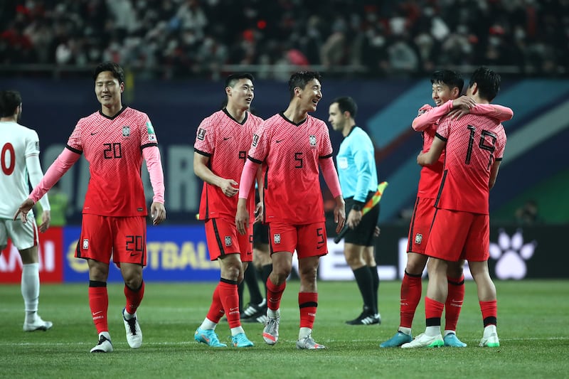 Son Heung-min celebrates with his South Korea teammates after the match. Getty