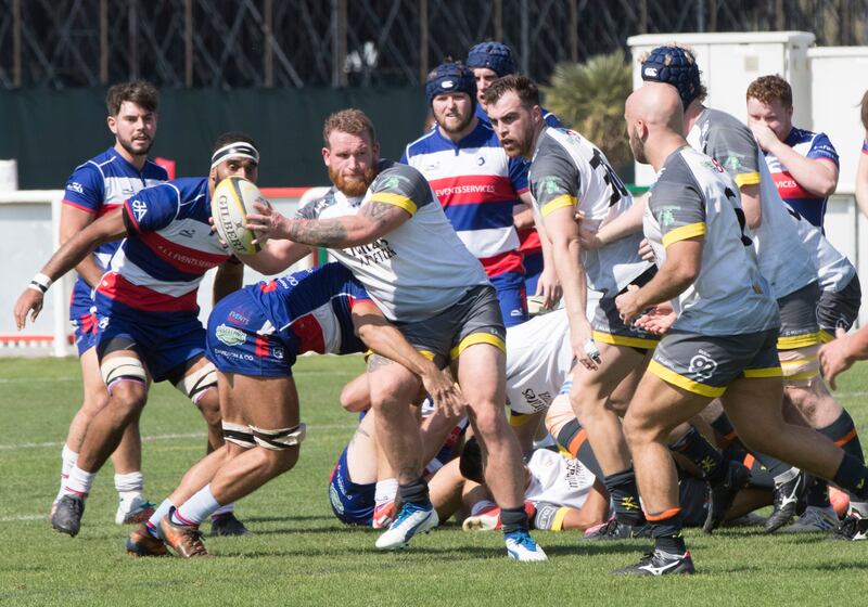 Dubai Hurricanes (grey/white shirts) take on Jebel Ali Dragons at The Sevens Stadium in Dubai on Saturday, January 22, 2022. Ruel Pableo for The National