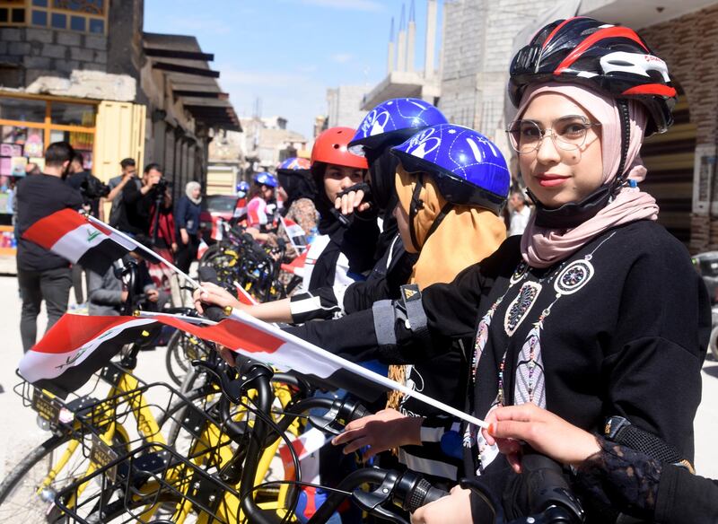 Cyclists prepare to start in the first all-female Mosul cycle race. The event was intended to help change attitudes in conservative Iraqi society about women and girls riding bicycles. EPA
