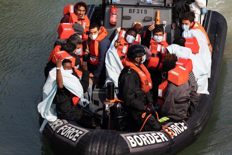 DOVER, ENGLAND - SEPTEMBER 22: Border Force officials unload migrants, that have been intercepted in the English Channel, in order to process them on September 22, 2020 in Dover, England. This summer has seen an increase in people making the journey in small crafts from France seeking asylum in U.K. (Photo by Luke Dray/Getty Images)