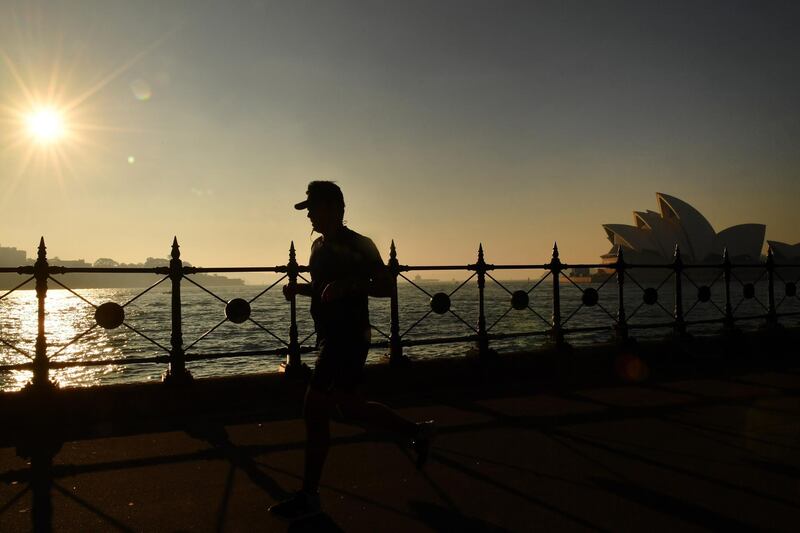 A jogger runs along Sydney Harbour as thick smoke blankets the greater Sydney Basin in Sydney, Australia, 24 May 2019. Sydney residents have been experiencing 'poor' to 'hazardous' levels of air quality for the fifth day as bush fire reduction burns continue.  All photos by Dean Lewins / EPA