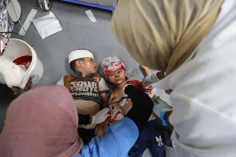 Palestinian children wounded in the Israeli bombardment of the Gaza Strip being treated in Al Aqsa Hospital in Deir Al Balah on Sunday. AP
