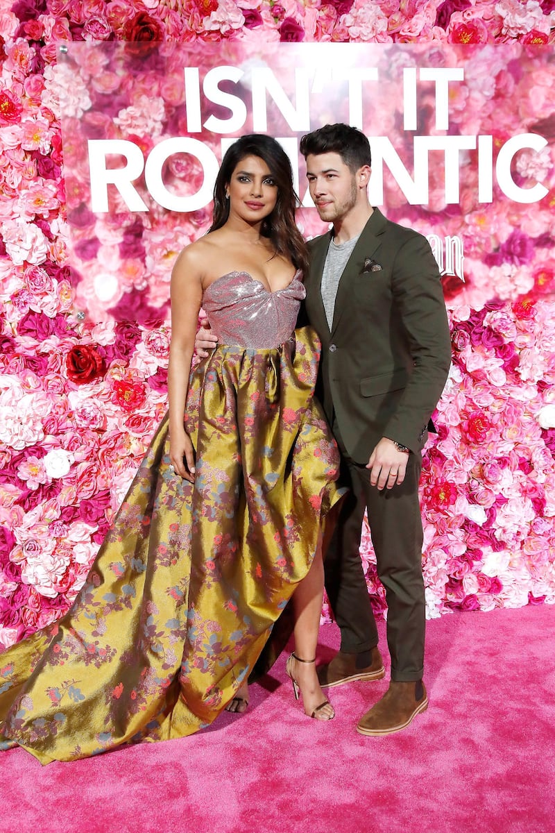 epa07363534 Indian-born US actress/cast member Priyanka Chopra (L) and her husband US singer Nick Jonas arrive for the world premiere of 'Isn't It Romantic' at The Theatre at Ace Hotel in Los Angeles, California, USA, late 11 February 2019. The movie opens in the US on 13 February 2019.  EPA-EFE/NINA PROMMER