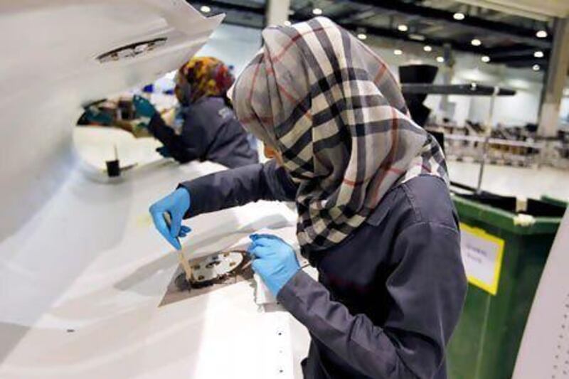 A technician at Strata's manufacturing plant in Al Ain. Female nationals account for 20 per cent of the workforce in the city. Jumana El Heloueh / Reuters