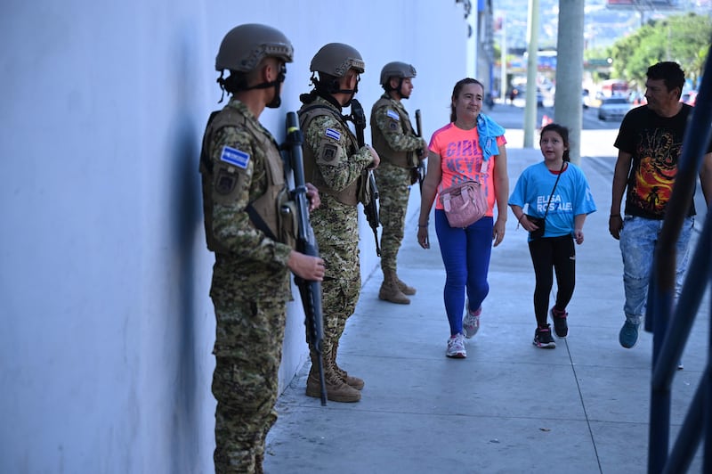 Soldiers stand guard during the presidential and legislative elections in San Salvador, El Salvador. AFP