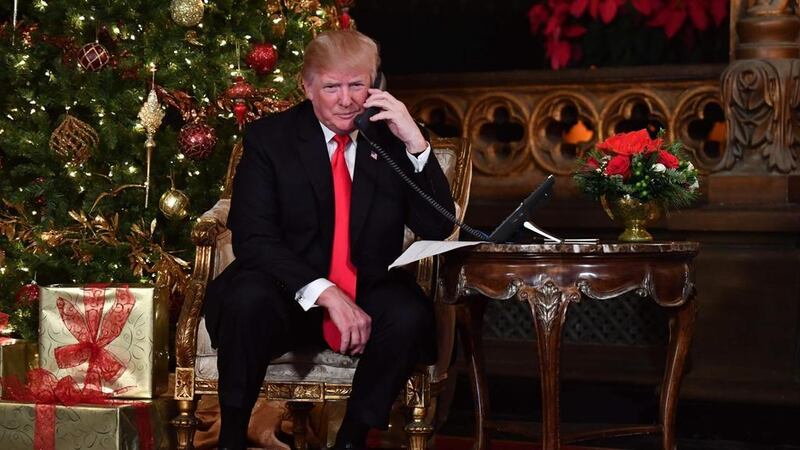 Having solved the Merry Christmas problem, Mr Trump no doubt will turn his mind to solving the problem of the America-wide ban on saying “Happy New Year” and “Happy Birthday”.   AFP / Nicholas Kamm