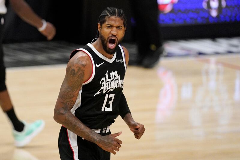 Los Angeles Clippers guard Paul George celebrates after scoring during the first half in Game 3 of the NBA basketball Western Conference Finals against the Phoenix Suns Thursday, June 24, 2021, in Los Angeles. (AP Photo/Mark J. Terrill)