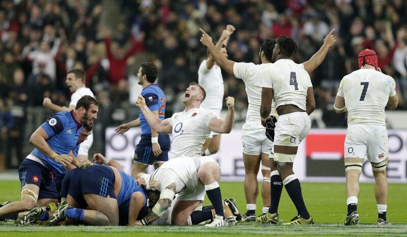 England’s George Kruis and teammates celebrate winning the Six Nations and the Grand Slam. Action Images via Reuters / Henry Browne