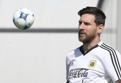 Argentina's forward Lionel Messi eyes a small ball during a training session at the team's base camp in Bronnitsy, on June 25, 2018 on the eve of the team's third game as part of the Russia 2018 World Cup Group D football match. / AFP / JUAN MABROMATA
