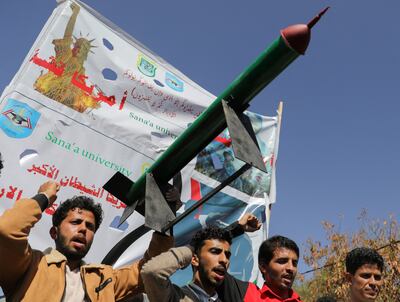 A mock missile is carried by university students at a rally in Sanaa to show support for Palestinians in the Gaza Strip and recent Houthi strikes on ships in the Red Sea. Reuters