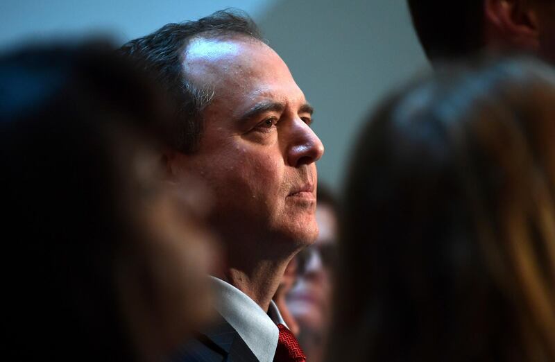 House Intelligence Committee ranking member Rep. Adam Schiff, D-Calif., center, listens to one of his colleagues speak to reporters on Capitol Hill in Washington, Tuesday, March 13, 2018. (AP Photo/Susan Walsh)