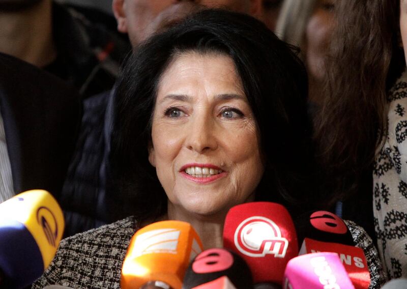 Salome Zurabishvili, former Georgian Foreign minister and presidential candidate, speaks to the media at her campaign headquarter in Tbilisi, Georgia, Wednesday, Nov. 28, 2018.  the French-born former foreign minister of Georgia Zurabishvili celebrated what she claims is her victory in a tight presidential runoff Wednesday that marks the last time Georgians elect their head of state by popular vote. (AP Photo/Shakh Aivazov)