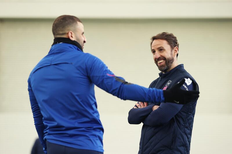 BURTON UPON TRENT, ENGLAND - MARCH 23: Gareth Southgate, Manager of England speaks with Kyle Walker of England during a training session ahead of an upcoming FIFA World Cup Qatar 2022 Euro Qualifier against San Marino at St George's Park on March 23, 2021 in Burton upon Trent, England. (Photo by Eddie Keogh - The FA/The FA via Getty Images)