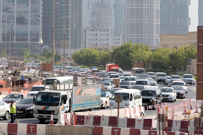 Dubai, United Arab Emirates - September 10, 2013.  Traffic building up as early as 8:30 am in this small temporary roundabout at the back of the JLT towers but slowly improving due to securities or traffic enforcers around the area.  ( Jeffrey E Biteng / The National )  Editor's Note;  Caline M reports. *** Local Caption ***  JB100913-Traffic02.jpg