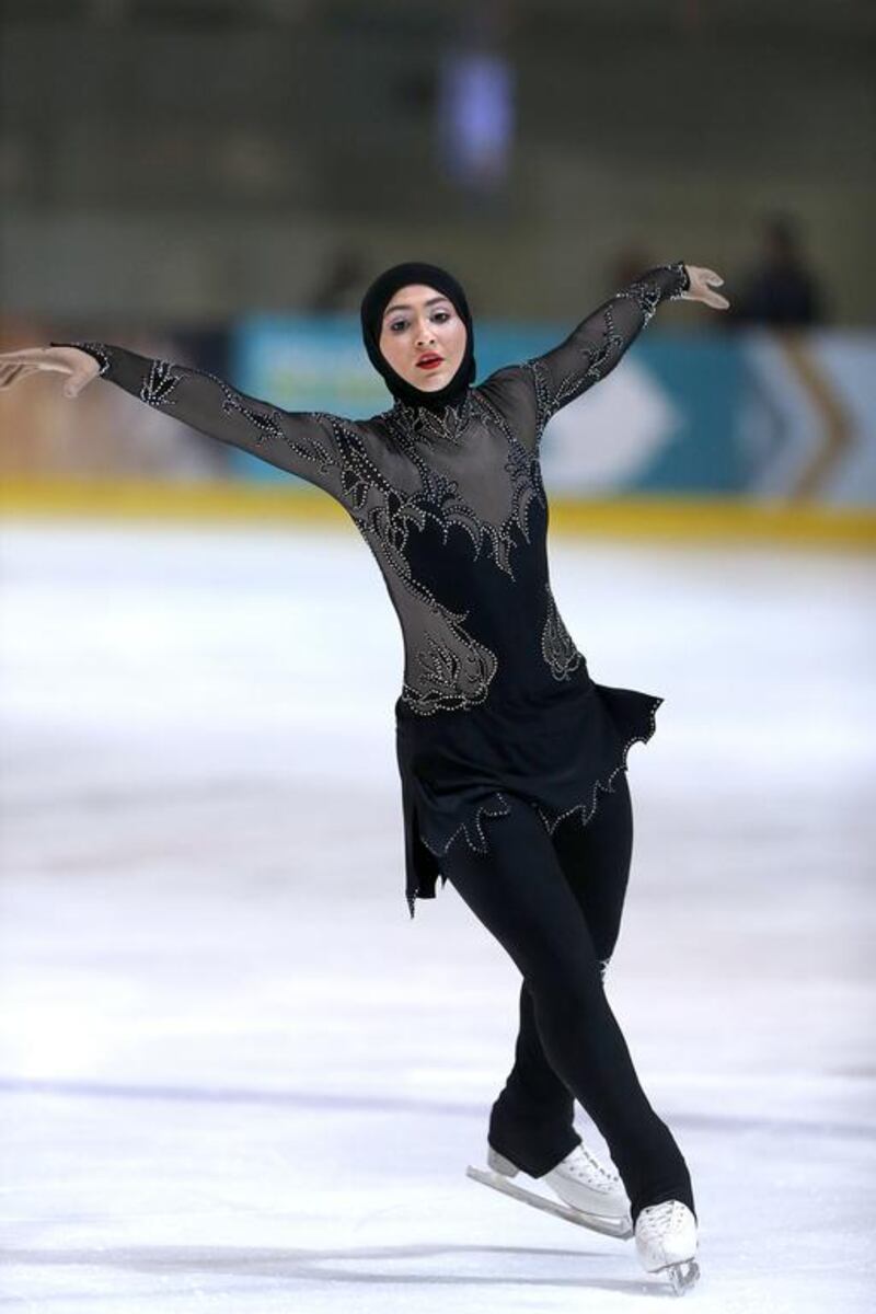 Zahra Lari performs at the International Figure Skating Championship in Abu Dhabi last year. She says she feels proud when people ask her about her hijab. Silvia Razgova / The National