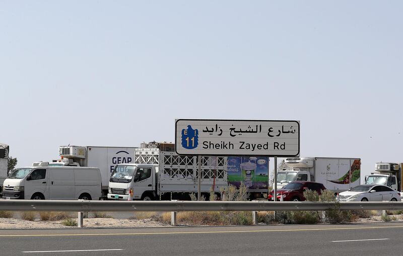 DUBAI, UNITED ARAB EMIRATES , June 2 – 2020 :- Traffic jam at the Dubai border going towards Abu Dhabi on Sheikh Zayed road in Dubai. Abu Dhabi Police checking the movement permits at the police checkpoint on the Dubai – Abu Dhabi border on Sheikh Zayed road in Dubai. Abu Dhabi impose one week ban starting from Tuesday on travel on entering and leaving the emirate to reduce the spread of Covid-19  and ensure its huge testing drive works. (Pawan Singh / The National) For News/Online 