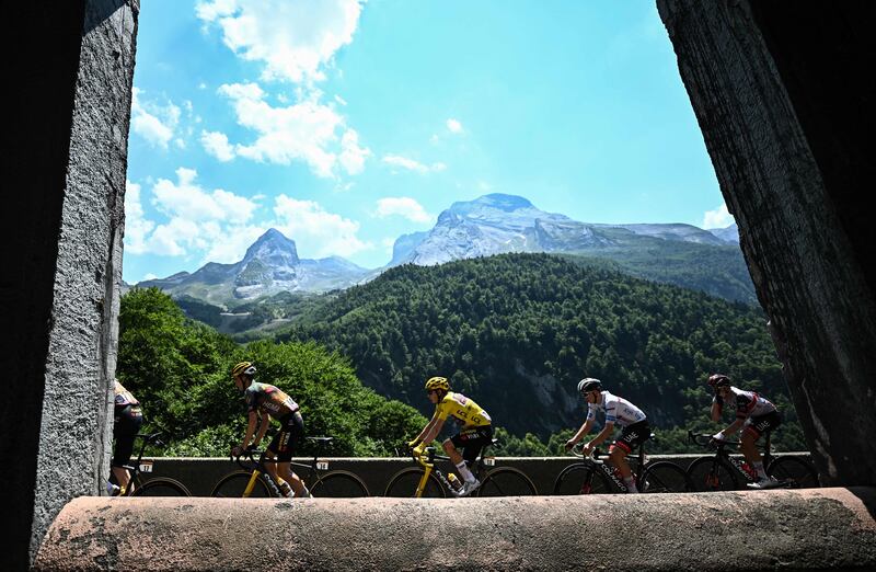 Left to right: Sepp Kuss, Jonas Vingegaard, Tadej Pogacar and Brandon McNulty on the Col de Spandelles during Stage 18 of the Tour de France, on July 21, 2022.  AFP