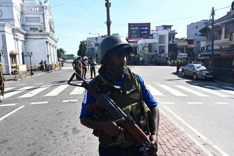 A member of the security personnel stands guard outside St. Anthony's Shrine in Colombo a day after the church was hit in a series of bomb blasts targeting churches and luxury hotels in Sri Lanka. AFP